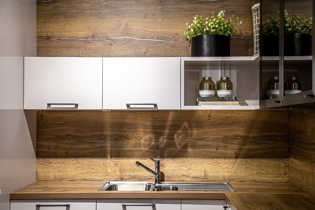 Modern waooden kitchen interior, steel kitchen faucet.